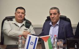 صورة سابقة خلال لقاء حسين الشيخ مع منسق الاحتلال