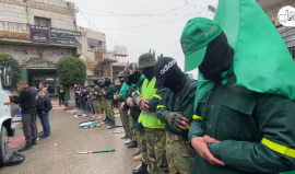 مسير عسكري في بلدة بيت أمر بالخليل في ذكرى انطلاقة حركة حماس الـ34