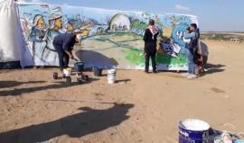 #مباشر 

رسم جدارية للعودة من مخيم العودة شرق المحافظة الوسطى. 

مراسلنا : احمد المقادمة