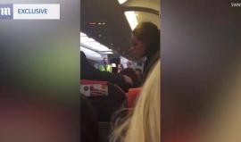 #شاهد الشرطة البريطانية تنزل راكبين من طائرة كانت عائدة من العاصمة التشيكية براغ إلى لندن بعد هتافهما "الله أكبر"!