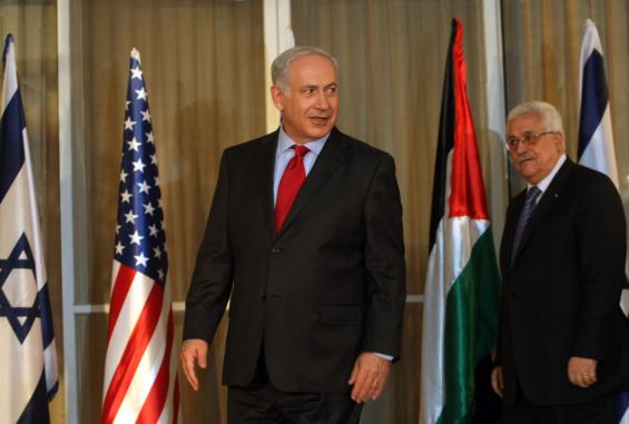 Israels-Prime-Minister-Benjamin-Netanyahu-stands-with-Palestinian-President-Mahmoud-Abbas